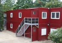 Teaching stadium built of flat pack containers coat in striking color