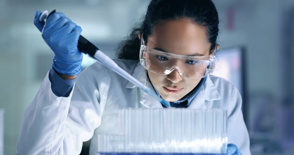 One young, serious and professional medical researcher organizing, sorting or making a discovery