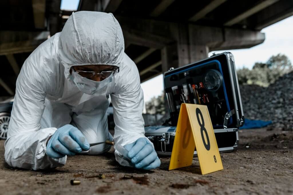 Senior forensic scientist working at crime scene