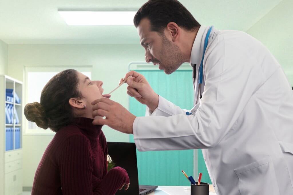 Doctor is taking a throat swab collection on a patient