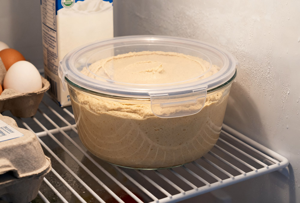 hummus is stored in the refrigerator
