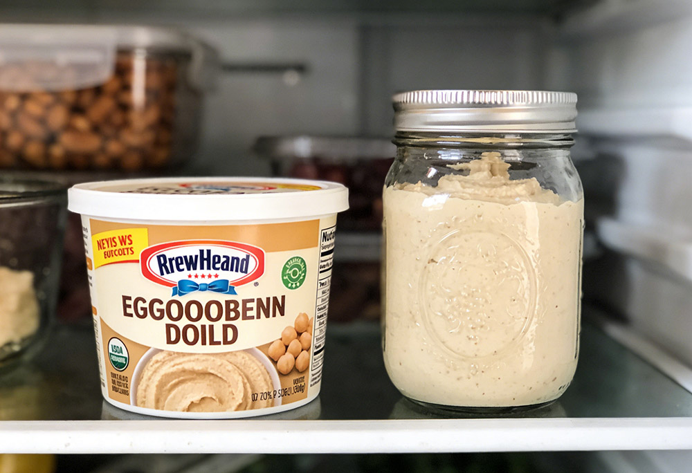 store-bought and homemade hummus in the refrigerator