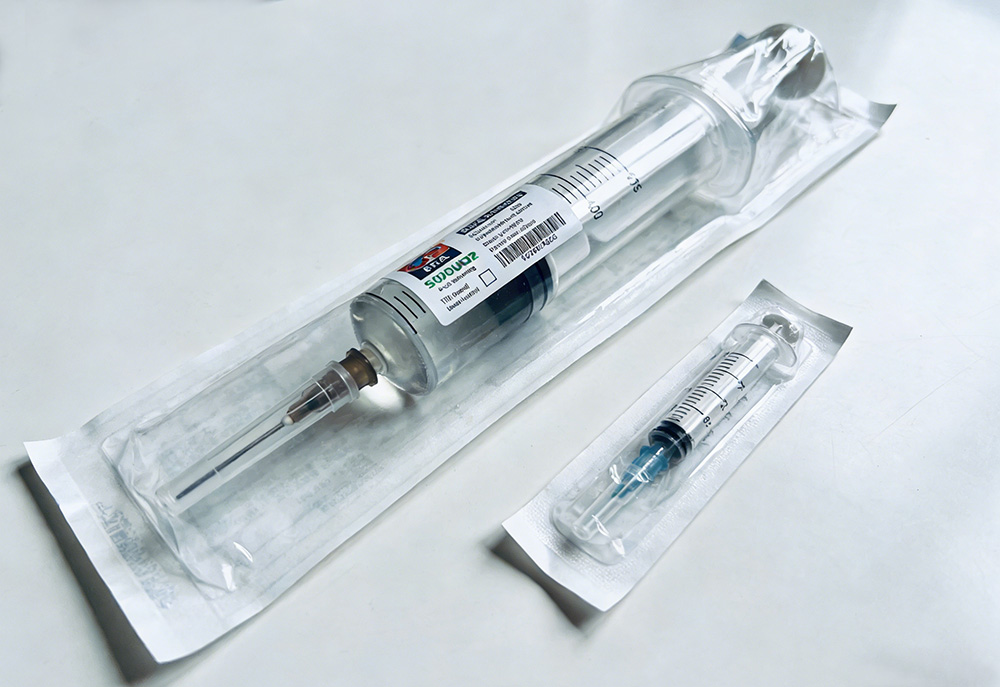 two unopened syringes